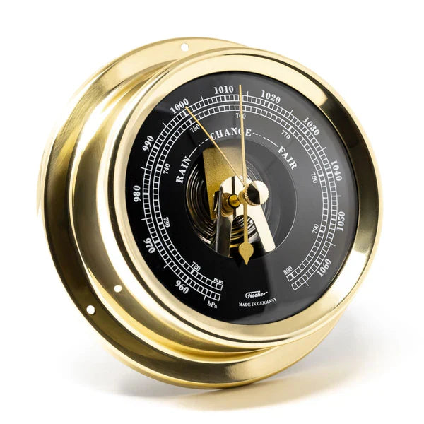German brass barometer with black dial, nautical weather instrument, wall mounted
