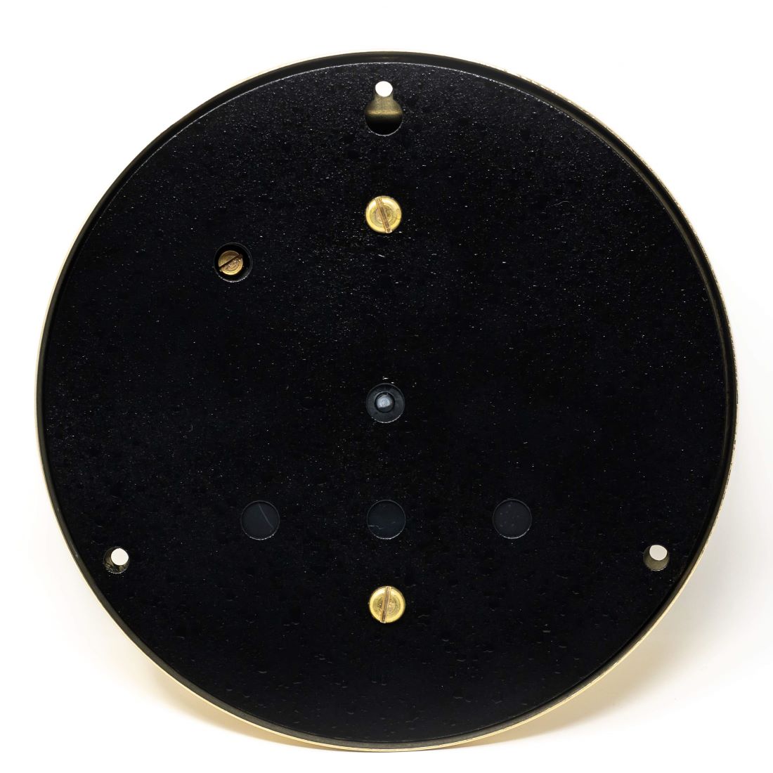 Back view of round black barometer or clock case with mounting screws and brass hardware