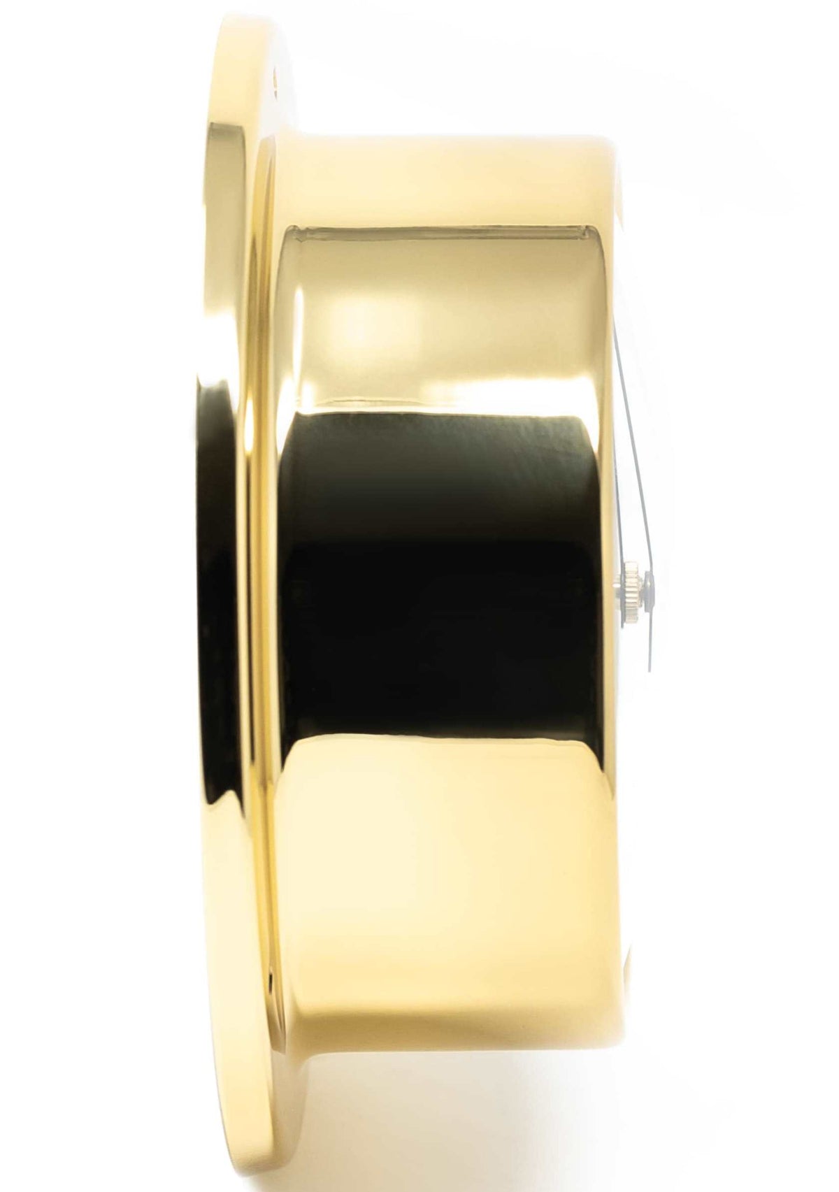 Side view of a polished brass barometer or clock case with reflective surface